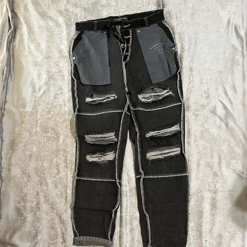 Maniere De Voir black cut up jeans in a size 12